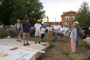 The team receiving the daily building instructions from Brian at "circle."