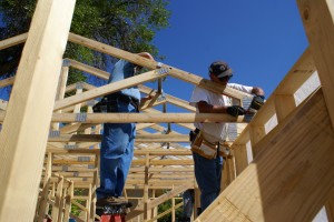 Trusses being nailed in place.