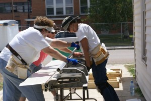 An all female crew bending the foundation flashing.