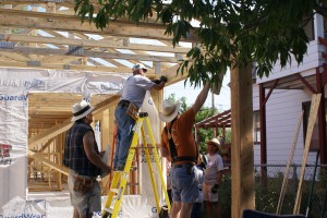 Installing roof trusses over the front porch.