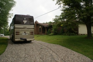 The coach in the new pull-through driveway in front of the house.