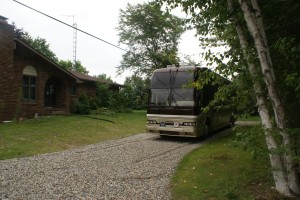 The coach in front of the house, waiting for its next trip.