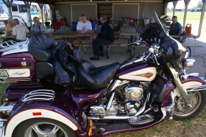 Bill Gerry’s Harley Davidson with Leyman trike conversion.  Bill is in the center of the photo, directly behind the bike (dressed in black, of course).