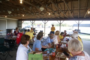 GLCC president Larry Baker (standing, rear) conducting a chapter information meeting immediately following dinner.