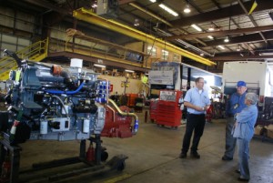 Van Hool operations manager Mike Papp talking to Linda and another FMCAer.