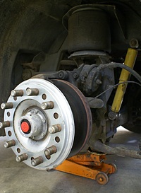 Centramatic dynamic wheel balancer on driver-side front wheel.