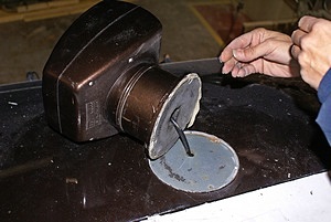 Applying putty to base of Searchlight