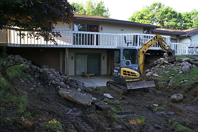 The excavator working on the rear retaining walls.