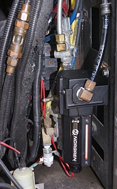 Norgren auxiliary air filter / water separator (lower right).