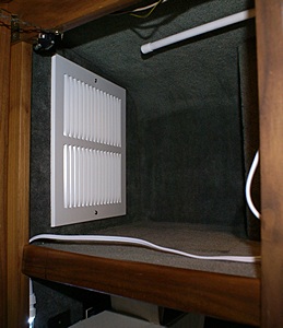 The first of two return air grills that allow air to pass through the upper portion of the center rear closet.