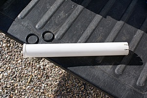 The salt restraining tube for the water filter housing.  The slotted end (R) goes down and the o-rings sit in the other end.