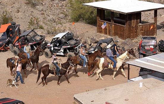Patrons arrive at The Desert Bar on the original, 1 HP, ATV.