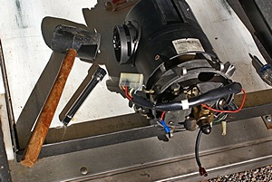 The burner assembly with the outer housing partially off (or on).
