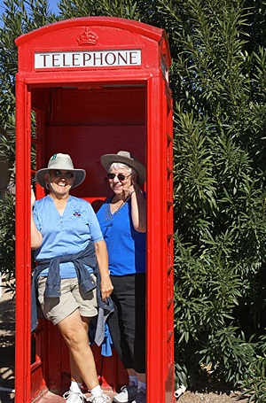 Linda& Marilyn at the London Bridge English village. It's a real London phone booth, but no phone.