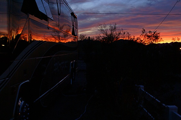 Another dramatic sunset reflected off the recently waxed driver's side of our coach.