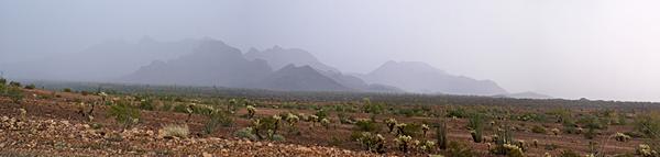 Heavy rain over the mountains and desert east of Quartzsite and south of Plomosa Road.