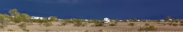 Looking east from AZ-95 at part of the Plomosa Road BLM STVA with heavy storm clouds in the distance.
