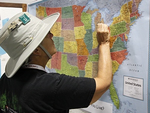 Linda puts a pin on the map to mark our home town.