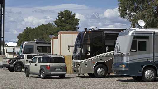 Our motorcoach, parked in an out-of-the-way place with Cathie & Bud Carrs motorhome, Travis & Melanie Carr's Airstream, and the Rivolli Review's motorhome.