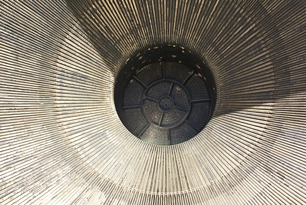 The exhaust nozzle of a Saturn V rocket engine. It is more than wide enough for a person to stand up in it.