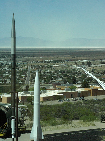 The view to the west from the 4th floor of the New Mexico Space History Museum. The "white sands" are visible on the horizon and blowing into the air.