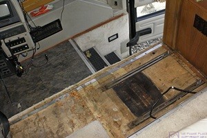 The entry stairwell and passenger seat area of our H3-40. Note the two mounting channels for the passenger seat