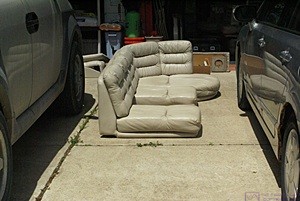 The upper portion of the passenger side J-lounge sitting in the driveway waiting go in the garage.