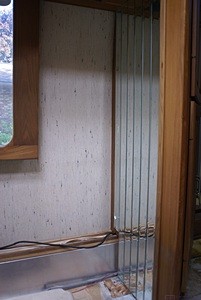The dinette seat used to fit in this corner The strip mirrors have been removed from the outside wall next to the window.