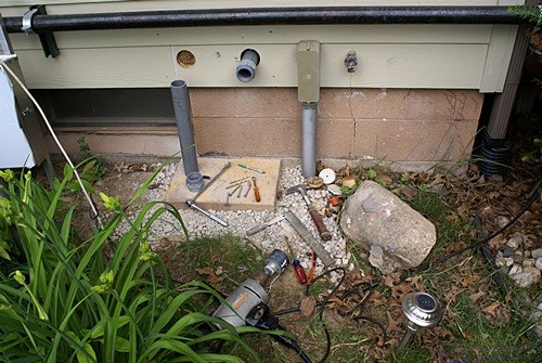 The east end of the house with two 2" holes for the conduit.