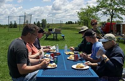 SLAARC members enjoying lunch outdoors at the Field Day site.