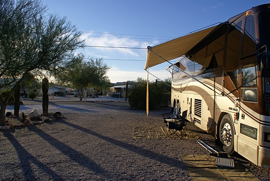View looking west of our coach and site in the late afternoon sun.