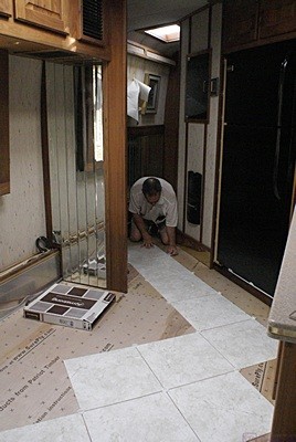 Dry fit of Armstrong Alterna floor tiles. The starting point was where the kitchen was where the kitchen transitions into the hallway.