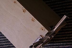 Two pieces of one of the plenum boxes held at right angles for gluing and screwing.