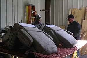 Josh (R) confers with Tyler (L) as he is working on getting the new Flexsteel pilot and navigator seats ready to install.