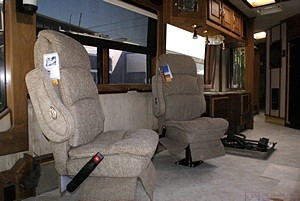 The two class C captain’s chairs installed on the passenger side of the living room.
