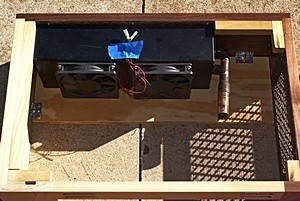 The right desk base viewed from above/behind showing the fans mounted on the back side of the heat-exchanger.