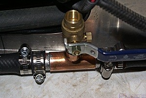 A close up view of the fill/bleeder valve assembly for the heat exchangers in the desk bases.