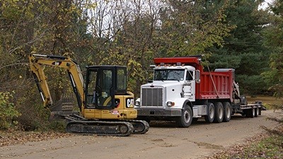 A closer view of Phil’s truck and excavator. He can move a lot of dirt, rock, and anything else he wants with this thing.