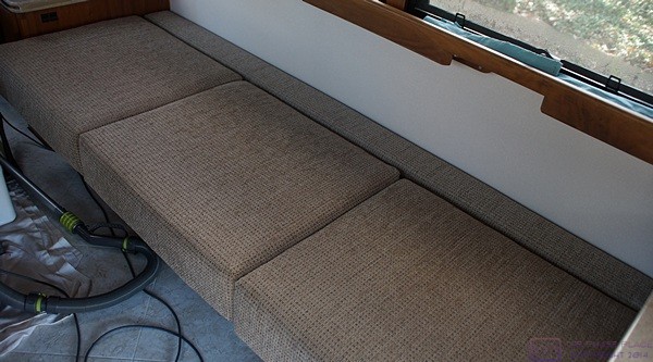 The seat cushions and spacer cushion for the built-in sofa in the bus.