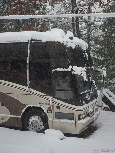 Snow piling up around the bus less than a week before our planned departure for Florida. 