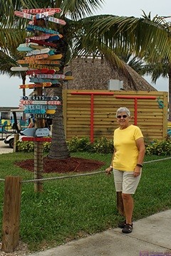 Linda by the signposts at the Charlotte Harbor Sheraton Four Points Hotel, Punta Gorda, FL.
