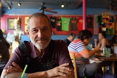 A rare photo of me taken by Linda. Even rarer is that I am smiling. But then, why not? I’m at The Cafe in Key West, Florida with my bride of almost 45 years about to enjoy a wonderful vegan meal. It doesn’t get much better than that.