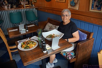 Linda at The Café in Key West, Florida right after our meals had come to the table. The Café has the Key West look and feel, but was nicer than most of the vegan restaurants we find. Vegan eateries tend to be near colleges and universities and cater to that clientele, so they do not waste a lot of money on fancy decor.